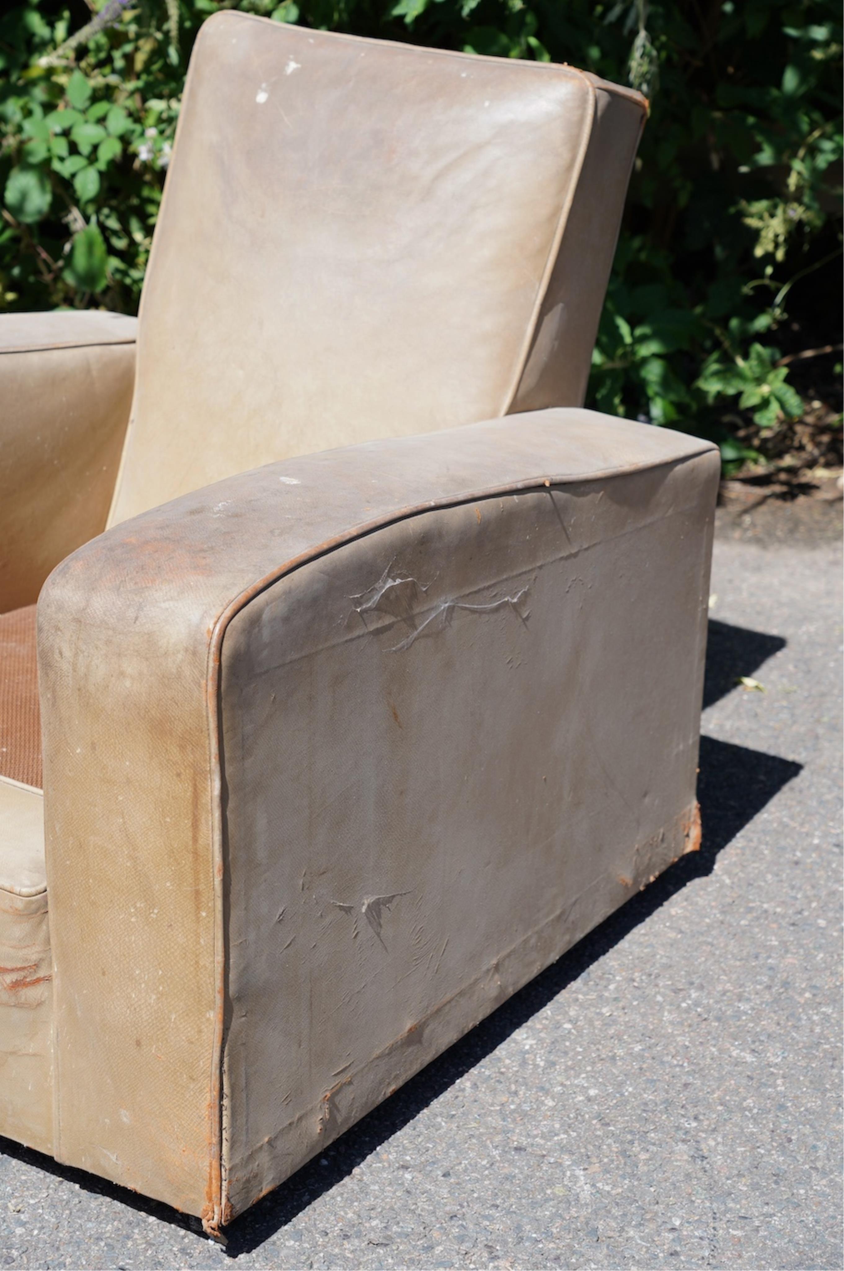 A pair of leather club armchairs, width 85cm, depth 88cm, height 84cm. Condition - poor